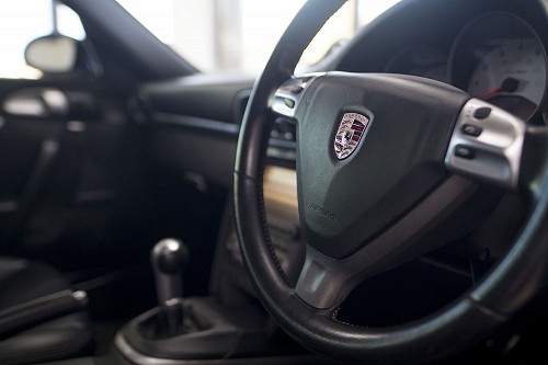 Black Porsche 911 turbo steering wheel
